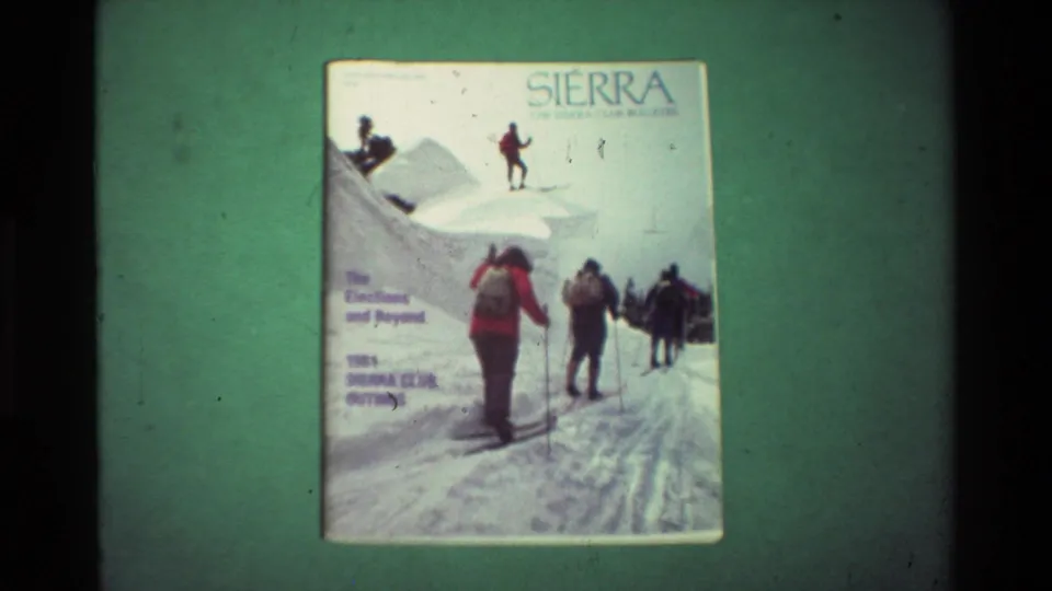 The Sierra cover stays in view, showing the winter recreation artwork and printed outings text on a green surface.