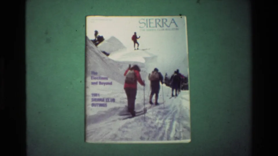 The Sierra cover appears larger in frame, with the snowy trail artwork and 1981 outings text still visible.