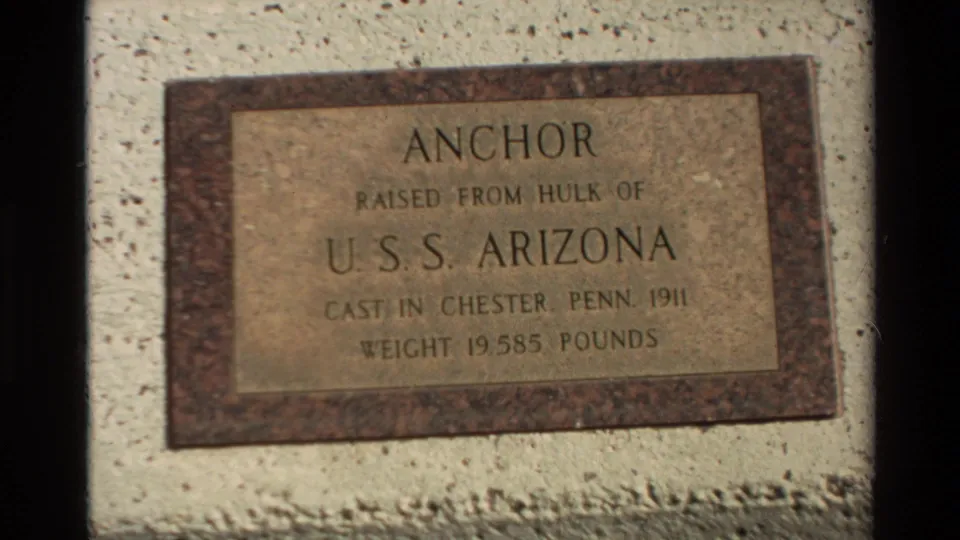 Final 1981 Hawaii frame centered on the USS Arizona anchor plaque, with cast date and weight text visible in soft focus.