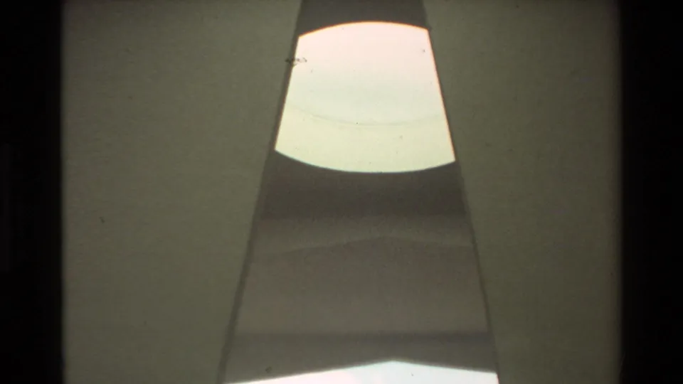 1981 Hawaii 8mm view looking upward through the USS Arizona Memorial interior toward a bright skylight-like opening.