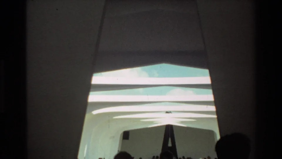 1981 Hawaii 8mm interior view of the USS Arizona Memorial, with white vaulted ceiling forms and visitor silhouettes at the bottom.