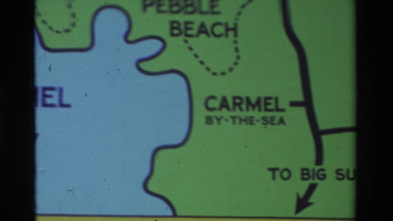 Carmel-area map frame showing Pebble Beach above the bay, Carmel-by-the-Sea inland, and text pointing toward Big Sur.