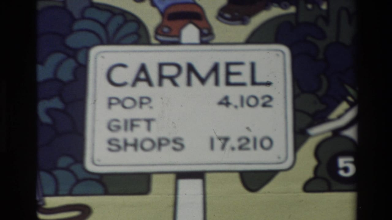 Cartoon Carmel sign reading population 4,102 and gift shops 17,210.