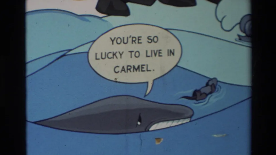 Final Carmel comic-strip frame holds on the whale in blue water and the speech bubble praising life in Carmel.