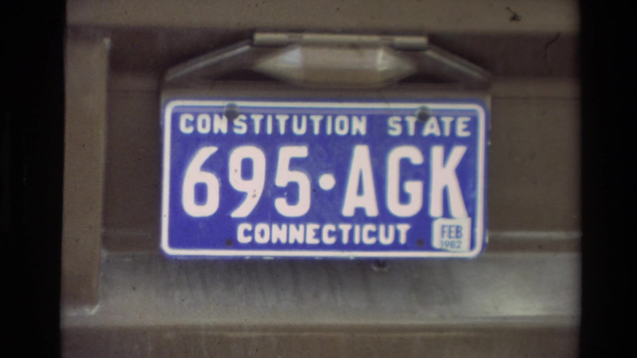 Close view of a Connecticut license plate mounted on a vehicle.