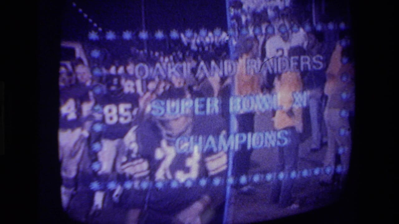 1979 California home-movie frame of a CRT screen showing Oakland Raiders players and championship broadcast text.