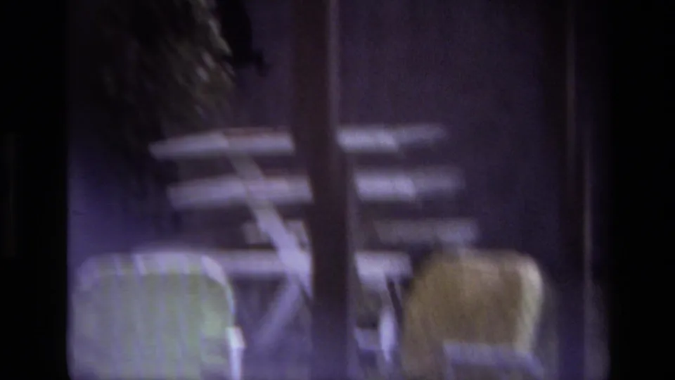 Soft 1979 8mm view of patio chairs and garden furniture in a shaded Laguna Beach backyard.