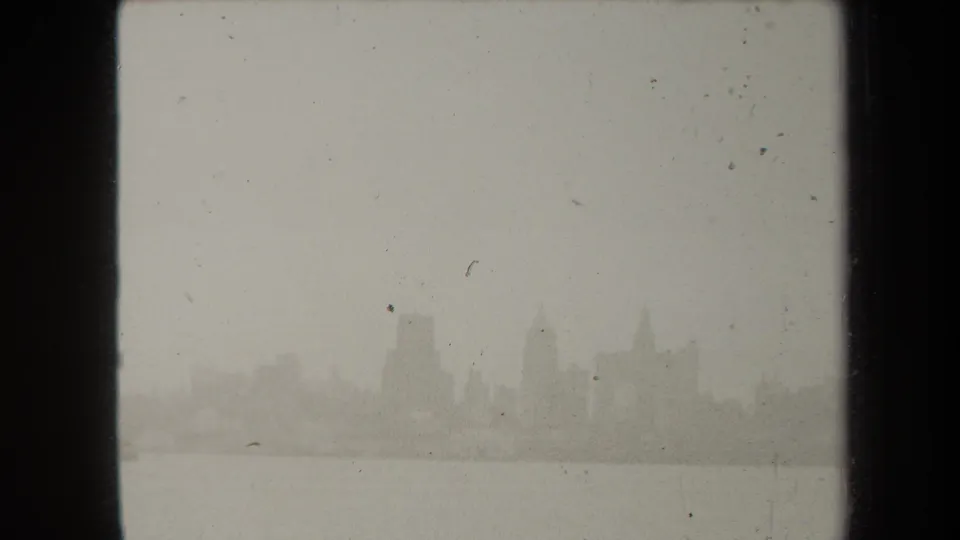 A final hazy 1938 New York skyline frame shows the city across the river, softened by exposure and physical film texture.