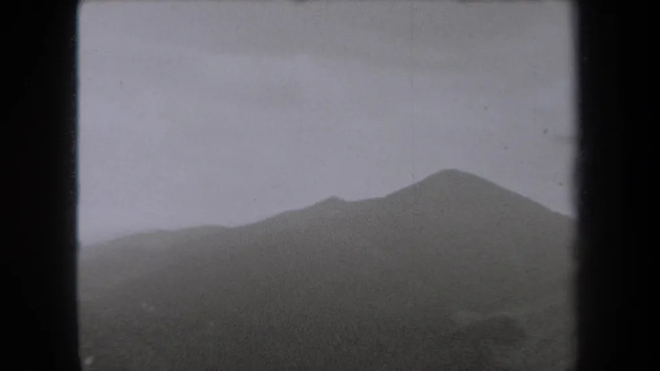 1938 New York 8mm footage showing a rounded mountain summit softened by fog and low cloud.