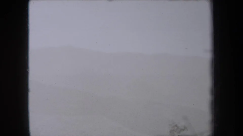 Soft 8mm view of pale sand and distant dune contours in the 1938 New York travel footage.