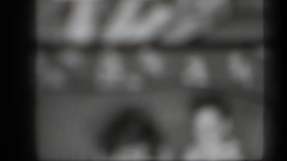 1939 New York 8mm home-movie frame with two heavily blurred figures in a dim interior-like view.