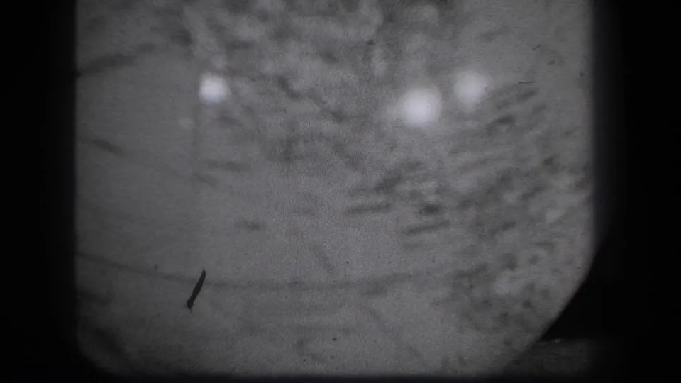 Close 1939 New York 8mm view of the globe surface, with map texture partly obscured by blur, dust, and reflected light.