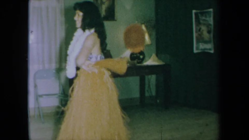 The final frame shows the 1961 California dancer in profile, holding pom poms with a white lei and grass skirt against a living-room backdrop.
