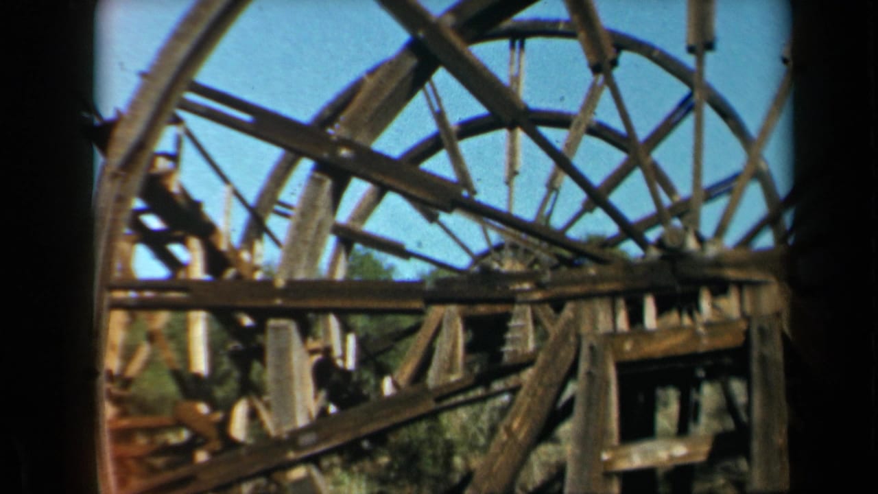 1969 8mm California footage appears to show a large wooden water wheel at a rustic roadside or historic setting.