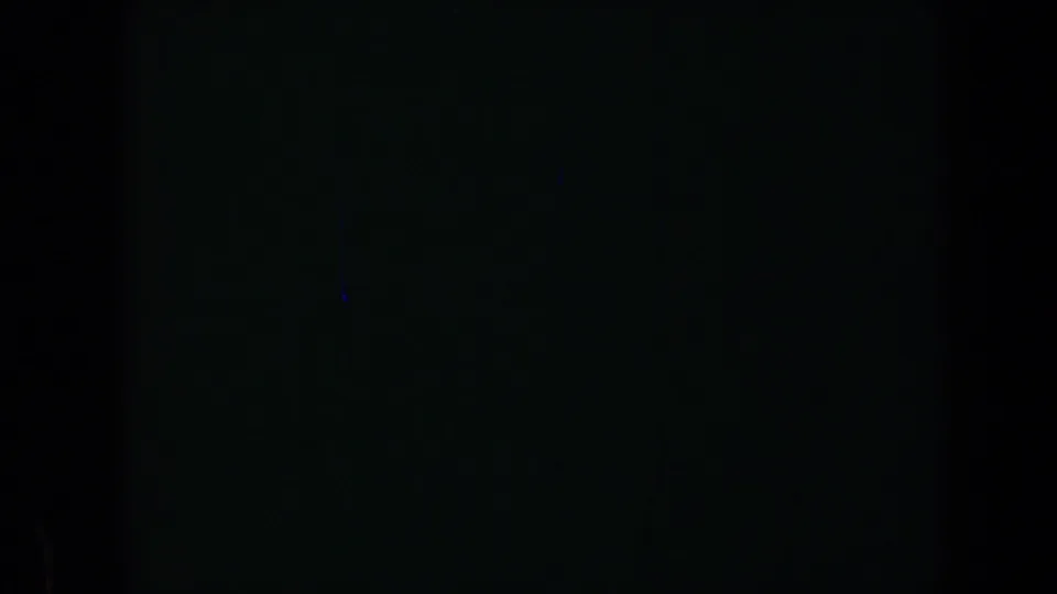 1969 California 8mm frame with a mostly dark lower view, subtle grain, and vertical film-shadow structure from the contact sheet.