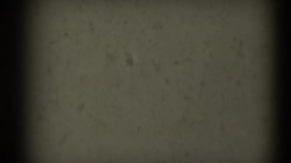End-of-reel 8mm frame from the supplied 1969 Sacramento clip, with dark borders, dust, scratches, and subdued exposure.