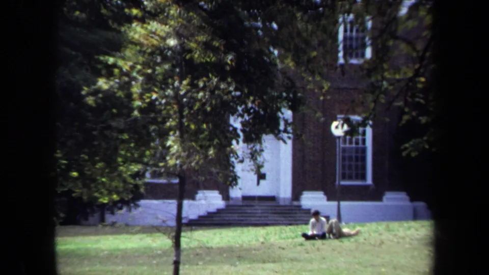 The final 1970 Annapolis frame shows people seated on the lawn near a white-columned entrance, with trees and brick walls in shade.