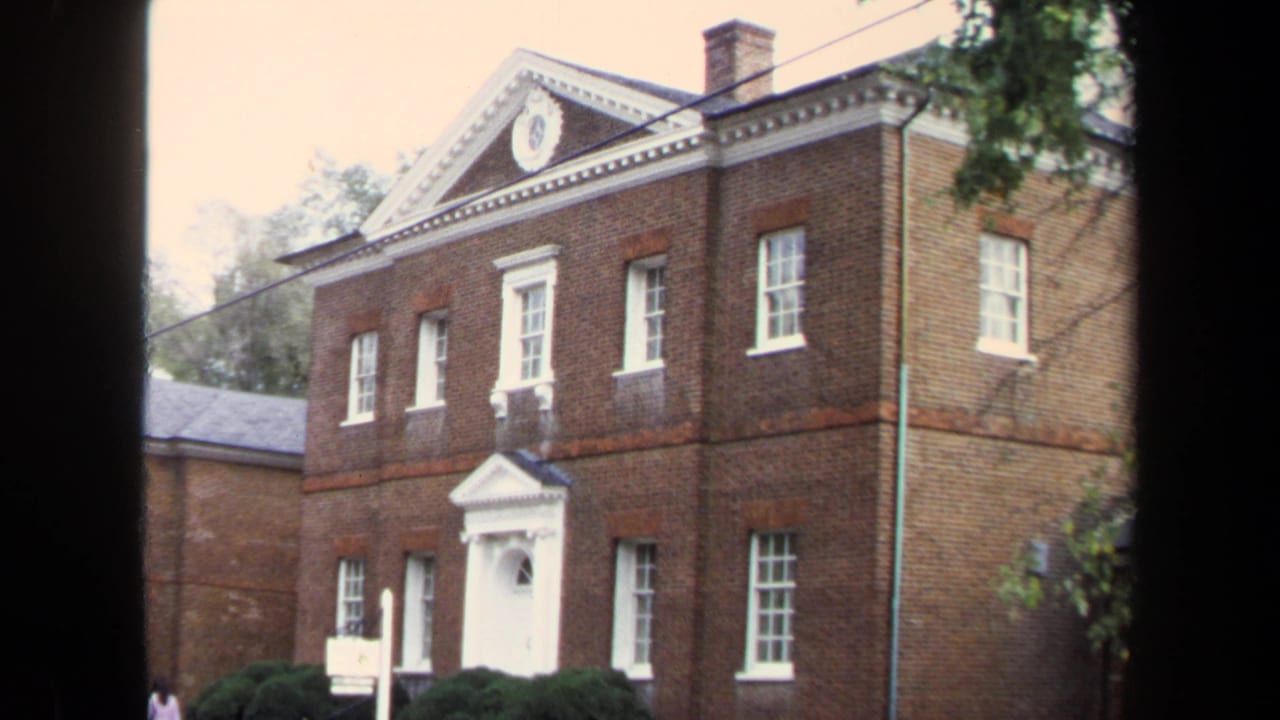 1970 Annapolis view of Hammond-Harwood House facade with white-trimmed windows, classical entrance, shrubs, and partial tree cover.