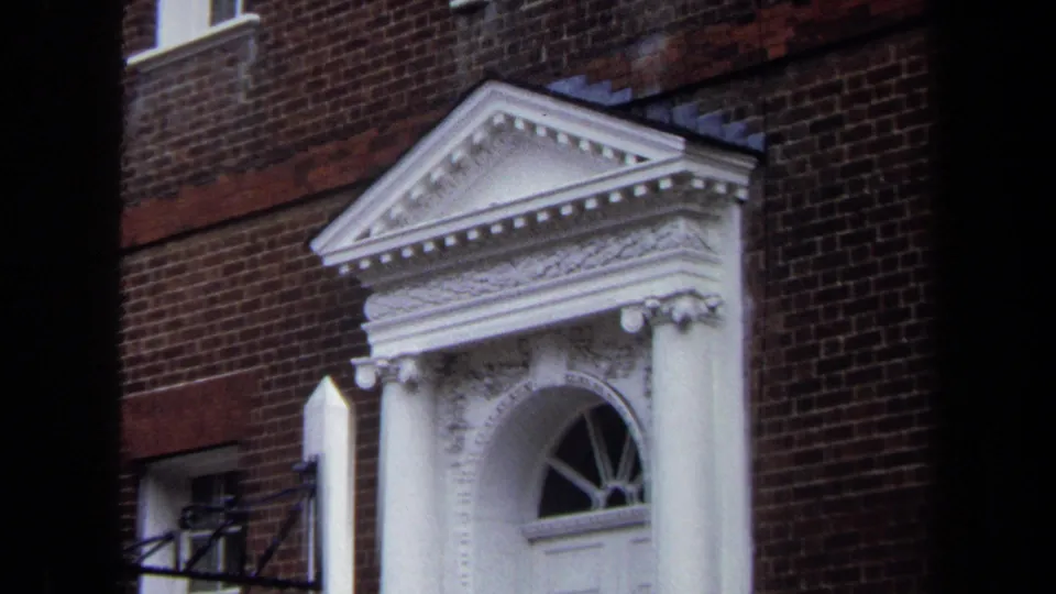 1970 Annapolis frame showing the Hammond-Harwood House museum entrance with a white pedimented surround and red brick exterior.