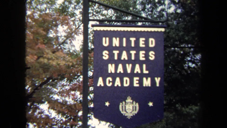 Centered 1970 Annapolis view of the United States Naval Academy banner, with gold text and crest visible.