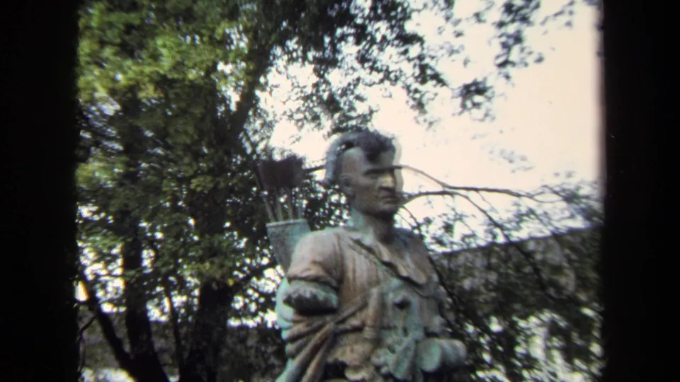Closer 1970 Annapolis home-movie view of the Native American warrior bust, showing the face, clothing detail, and arrows behind the shoulder.