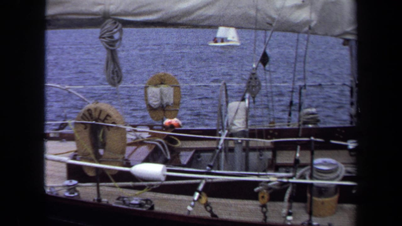 1970 Annapolis home-movie view from a sailboat deck with a JUBILEE life ring, rigging, ropes, and open water.