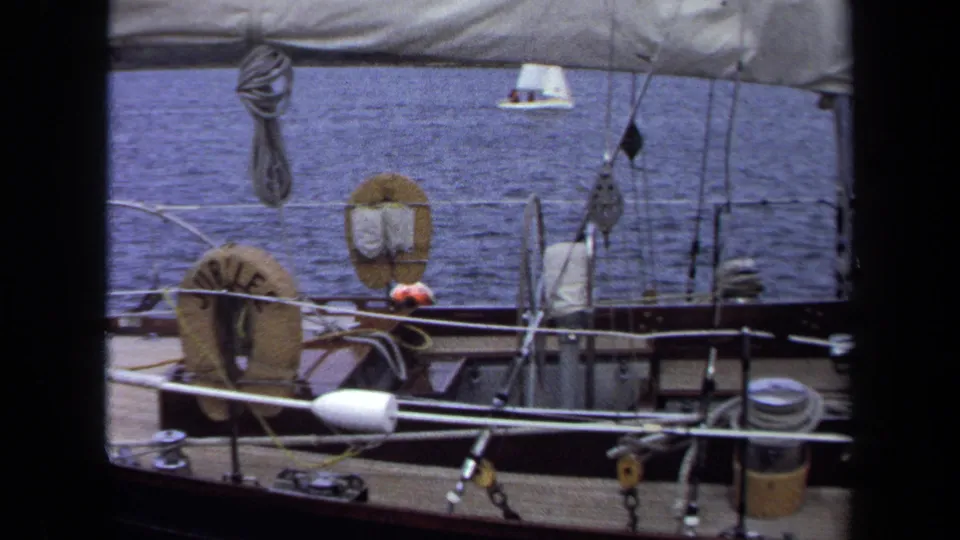1970 Annapolis home-movie view from a sailboat deck with a JUBILEE life ring, rigging, ropes, and open water.