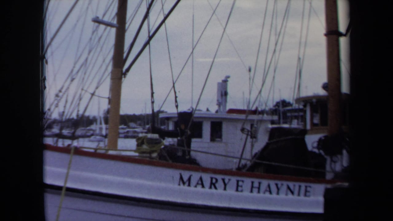 1970 Annapolis harbor view of the Marye Haynie name on a white vessel hull, framed by masts and rigging.