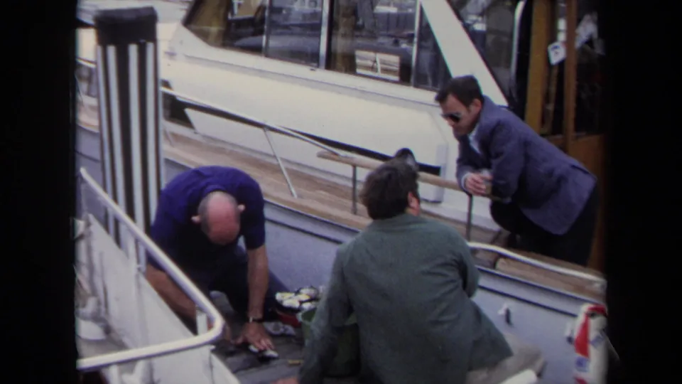 The final frame shows men around oysters on an Annapolis boat deck, with white railings, wood trim, and a suited observer in sunglasses.