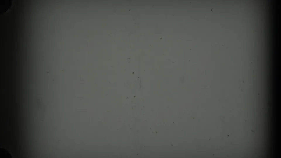 A blank 8mm frame shows muted leader material, dark borders, and a horizontal boundary across the frame.