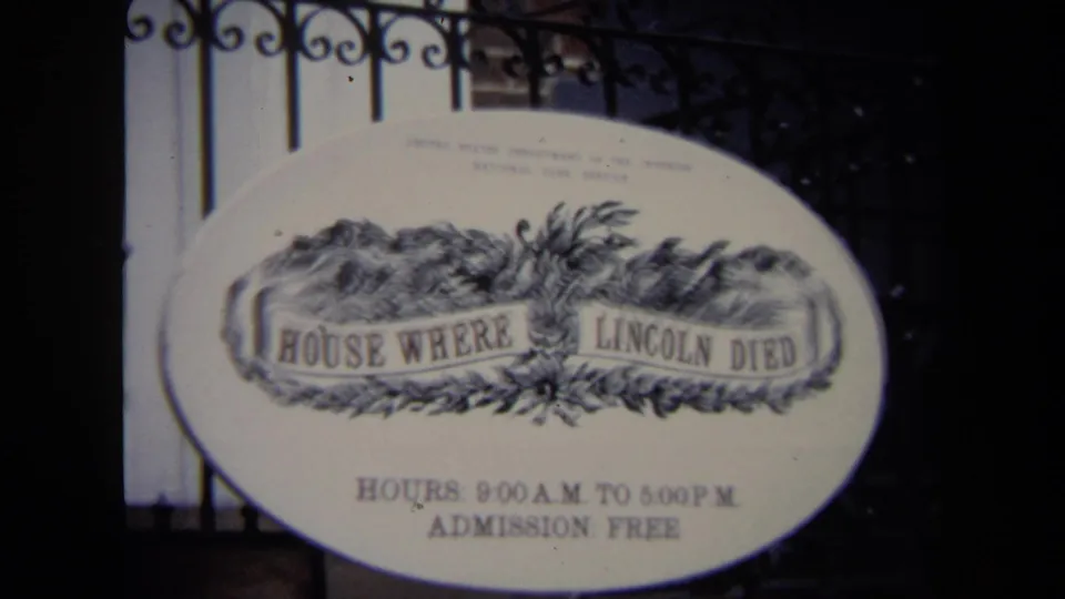 1970 Washington, DC frame centering the House Where Lincoln Died sign with hours, admission free text, railing, and steps behind it.