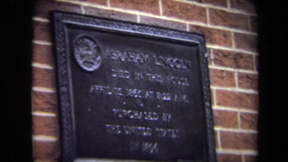 1970 Washington, DC close view of a bronze plaque on brick noting Abraham Lincoln died in the house on April 15, 1865.