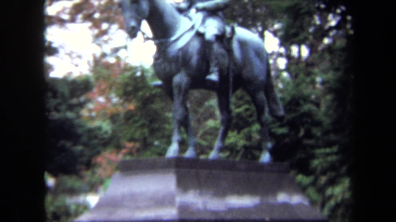 1970 Washington DC 8mm view of the lower portion of an equestrian statue, with horse legs on a stone pedestal.
