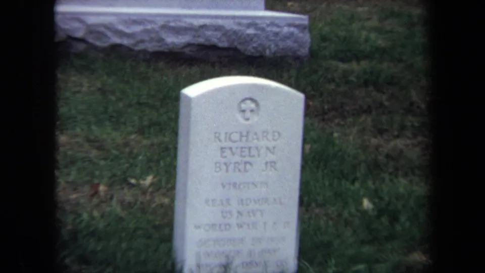 1970 Washington DC frame showing the Richard Evelyn Byrd Jr. grave marker in the foreground, with the McAdoo headstone partly visible behind it.