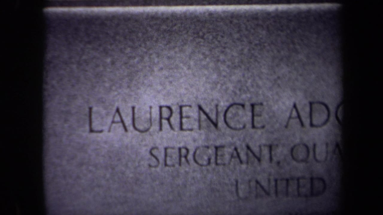 Tighter view of the tombstone inscription with the name and sergeant rank partly cropped.