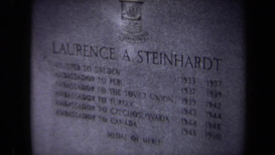 Close 8mm view of the Laurence A. Steinhardt grave marker, with diplomatic service lines carved below the name.