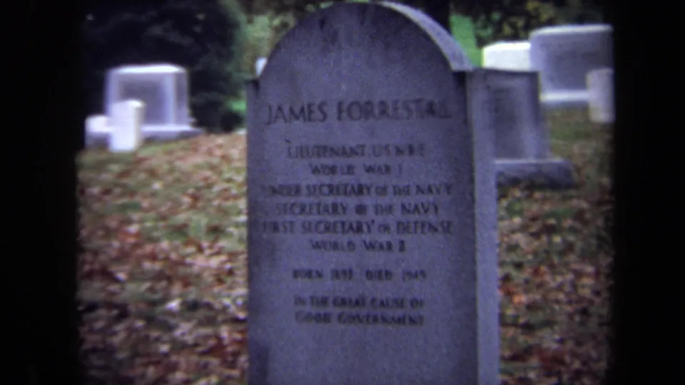 1970 Washington, DC 8mm frame showing a closer, slightly soft view of James Forrestal's headstone in a cemetery.
