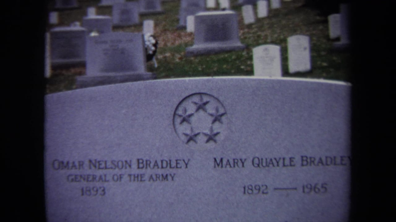 1970 8mm frame showing Omar Nelson Bradley and Mary Quayle Bradley's grave marker with uniform headstones in the background.