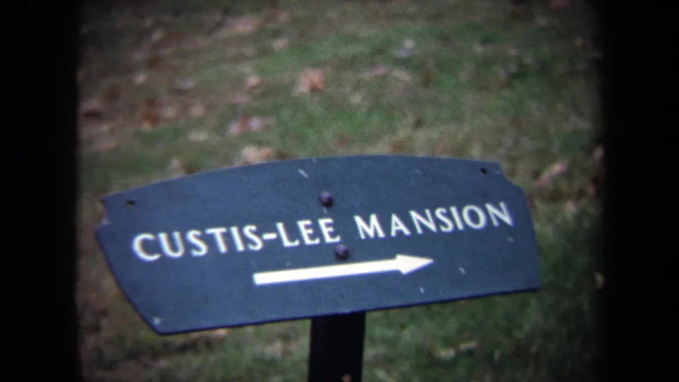 1970 Washington-area 8mm frame with a closer view of the Custis-Lee Mansion sign and white arrow.
