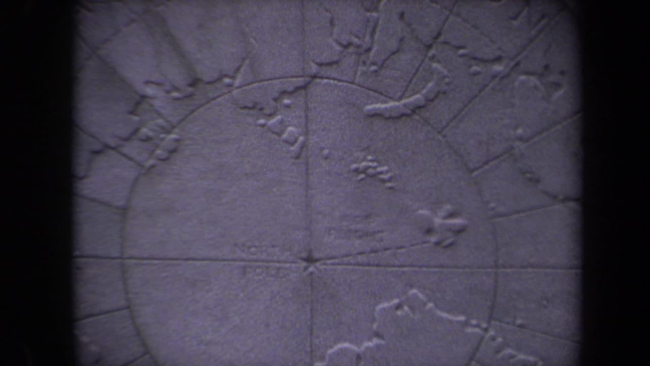 Raised map surface with polar grid markings, embossed islands, and soft blue-purple color.