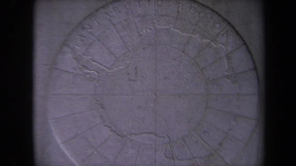 Final frame shows a closer polar relief map view with circular lines, faint North Pole lettering, and visible 8mm grain.