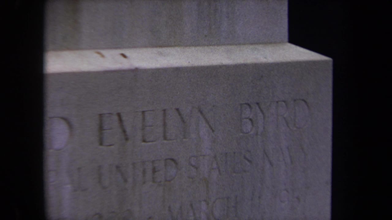 Close view of the gravestone inscription with Evelyn Byrd and United States Navy partly legible.