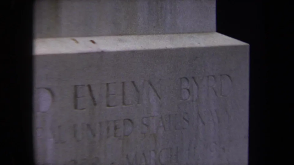 Washington, DC 1970 frame of the Byrd gravestone, with United States Navy lettering visible through dark vertical shadows.