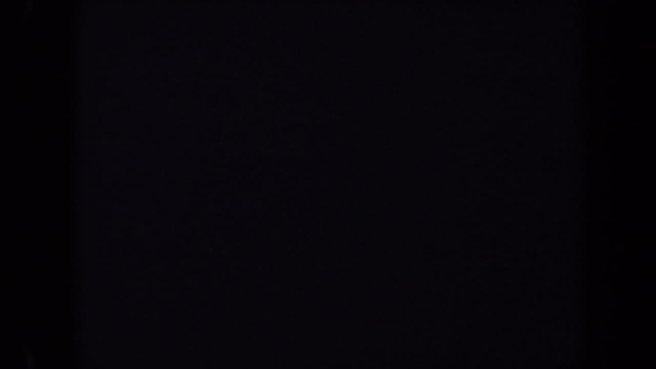 Dark opening frame from a 1970 Washington, DC 8mm home movie, with only faint film texture visible.