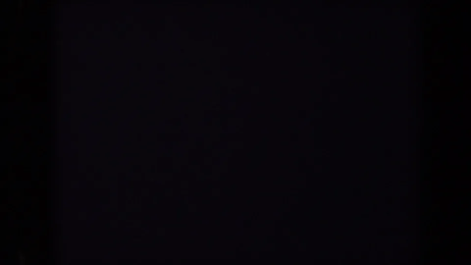 Dark opening frame from a 1970 Washington, DC 8mm home movie, with only faint film texture visible.