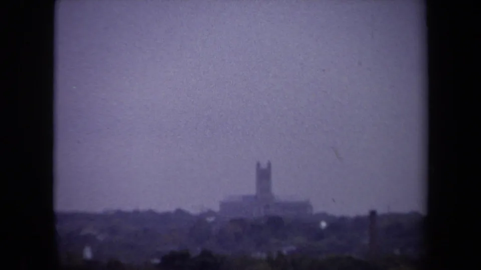 1970 Washington, DC view toward a distant steeple-like landmark and low skyline under a hazy sky.