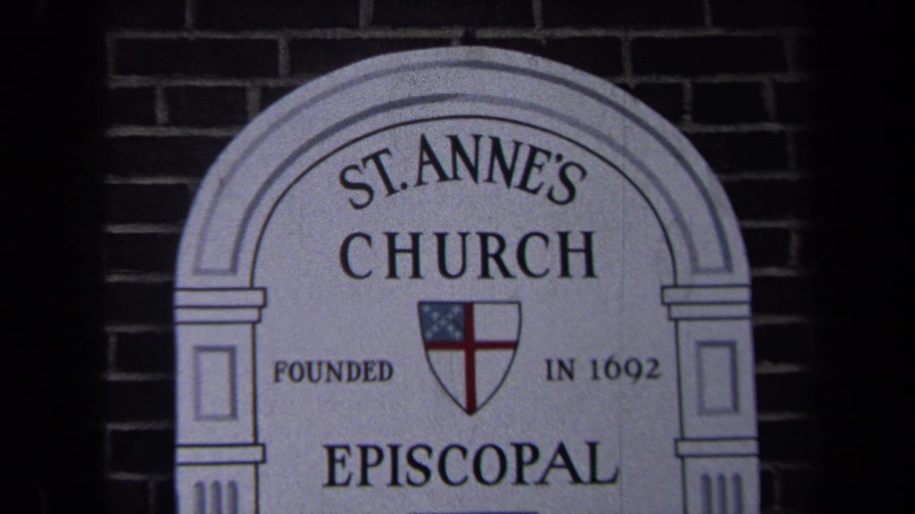 1970 Washington, DC 8mm frame showing the arched St. Anne's Church sign with Episcopal shield and founded date on a brick wall.