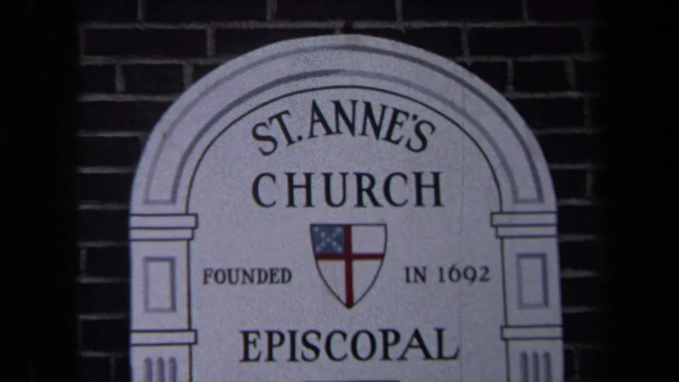 1970 Washington, DC 8mm frame showing the arched St. Anne's Church sign with Episcopal shield and founded date on a brick wall.