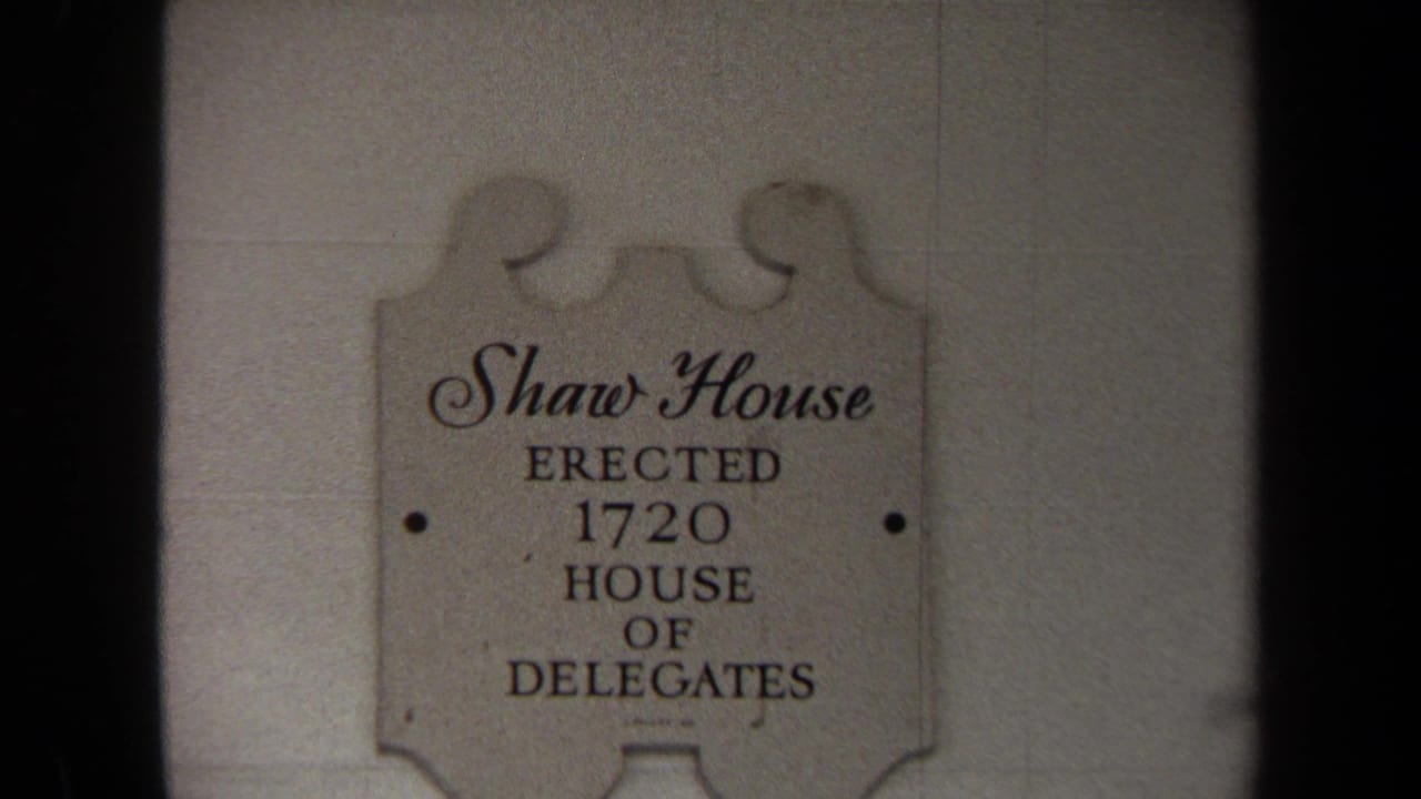 Plaque on a light wall reading Shaw House, erected 1720, House of Delegates.
