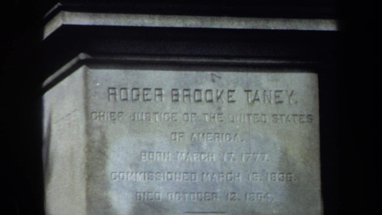Close view of a stone pedestal inscribed Roger Brooke Taney.